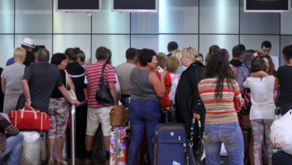 Tourists wait inside the airport in Egypt's Red Sea resort of Sharm el-Sheikh. (AFP/File)