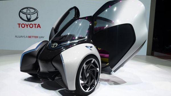 A Toyota i-TRIL electric concept car is displayed at Toyota's stand during the first press day of the International Motor Show in Geneva on March 7, 2017. (AFP)