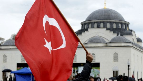 Supporters wave flags as they watch as Turkey's President Recep Tayyip Erdogan inaugurates the Diyanet Islamic Cultural Center in Lanham, Maryland on April 2, 2016. (Olivier Douliery) Supporters wave flags as they watch as Turkey's President Recep Tayyip Erdogan inaugurates the Diyanet Islamic Cultural Center in Lanham, Maryland on April 2, 2016. (Olivier Douliery)