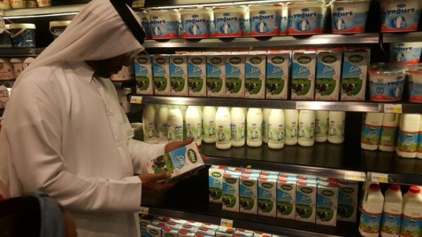 A customer reads the label on a Turkish dairy product at a supermarket in Doha. (The Peninsula) A customer reads the label on a Turkish dairy product at a supermarket in Doha. (The Peninsula)