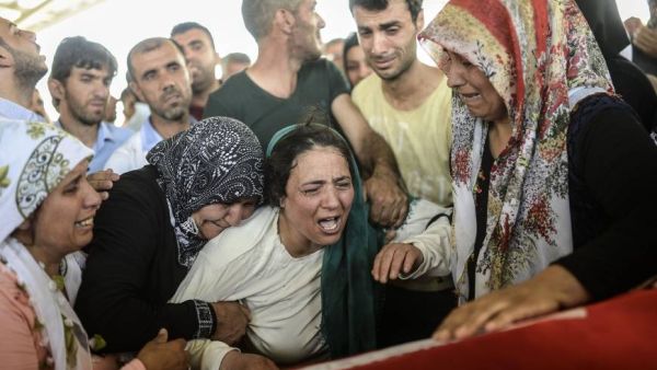 Family members mourn at the coffin of a man killed by a Daesh-linked suicide bombing in Suruç, Turkey last month.  (AFP/File)