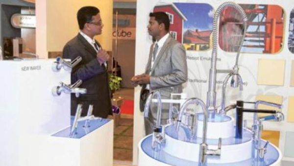 Exhibtor explaining the products of Rak Ceramics, during the Big 5 Show being held in Dubai Trade center.