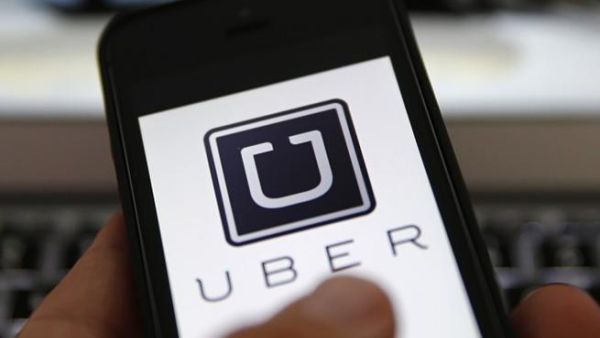 The Uber app being used on a cell phone (File photo)
