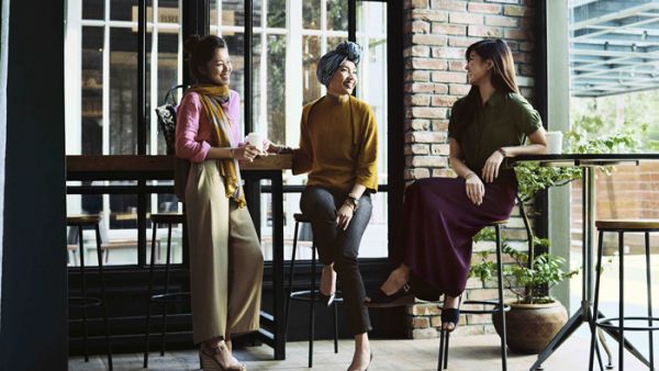 Malaysian singer Yuna, center, is pictured modeling Uniqlo's hijab fashion line designed by Hana Tajima. (Uniqlo)