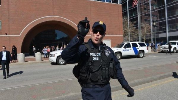 Police evacuate the area around the Boston courthouse after a bomb (AFP/ Stan Honda)