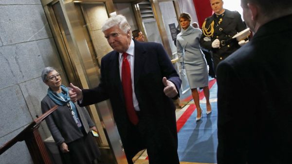 US President Donald Trump leaves after being sworn in followed by first lady Melania Trump on the West Front of the US Capitol during his inauguration ceremony, in Washington, DC, on January 20, 2017. (AFP/Win McNamee)