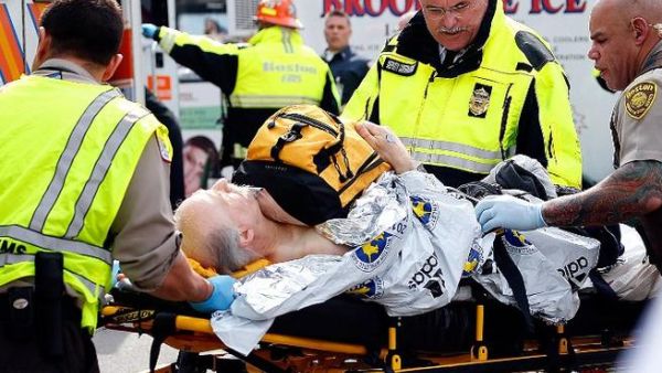 A man is loaded into an ambulance after being injured in the Boston Marathon bomb attacks (AFP/ Jim Rogash)