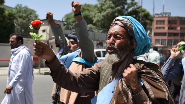 An Afghan peace activist arriving in Kabul on June 18 after marching from hundreds of kilometres from Helmand province, shouts a slogan demanding an end to the war. (Wakil Kohsar / AFP)