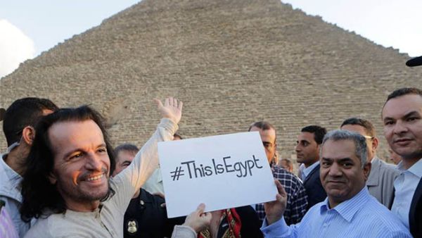 Yanni poses with one of the Great Pyramids of Egypt. (File photo)