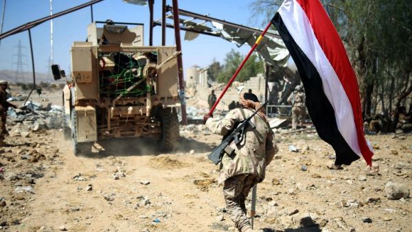 Loyalist forces carrying a Yemeni flag while on patrol in Marib. (AFP/File)
