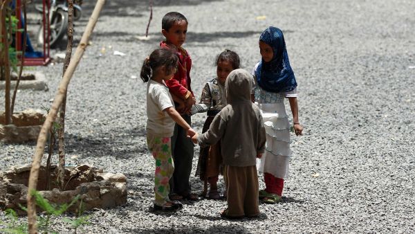 Yemeni children displaced by the country's ongoing war play outdoors.  A recent UNICEF report says an average of at least 6 Yemeni children have been killed or injured every day since the start of the conflict in March 2015.  (AFP/File)