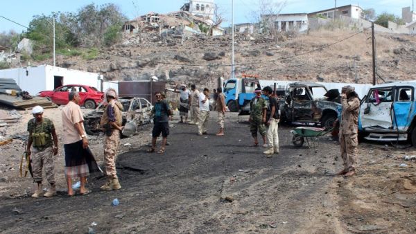 Pro-Hadi loyalist forces and civilians examine the aftermath of a suicide bombing in Aden. (AFP/Saleh al-Obeidi) Pro-Hadi loyalist forces and civilians examine the aftermath of a suicide bombing in Aden. (AFP/Saleh al-Obeidi)