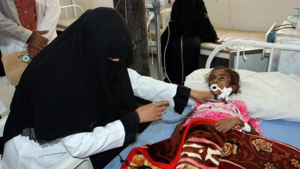 A doctor treats a malnourished Yemeni child at a hospital in the Yemeni port city of Hodeidah, on May 2, 2017. (AFP/Stringer)