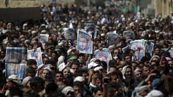 Supporters of the Shia Houthi movement hold portraits senior Houthi leader Lutf al-Quhom, who was killed in recent fighting, during his funeral on Feb. 18, 2016 in the capital Sanaa. (AFP/Mohammed Huwais)