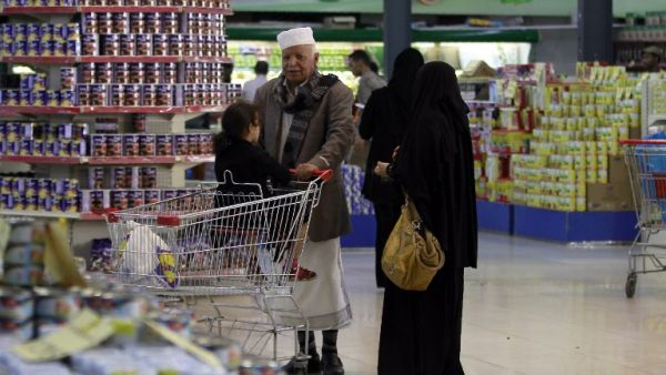 Yemenis shop at a supermarket in the capital Sanaa on May 17, 2016. Prices of goods and fuel have risen in the war-torn country since Monday due to the fall in the value of the Yemeni rial against the dollar. (AFP/Mohammed Huwais)