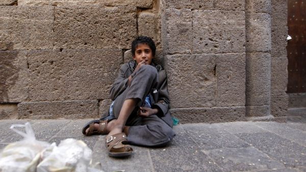 A Yemeni boy sits at a market in the old city of the capital Sanaa on October 21, 2016. (AFP/Mohammed Huwais)