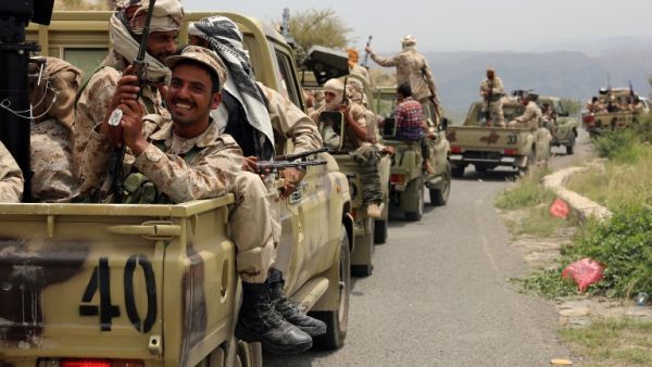 Yemeni fighters loyal to President Abedrabbo Mansour Hadi drive in convoy in the Yafa area some 180 kilometres north of the port city of Aden on August 9, 2016. (AFP/Nabil Hassan)