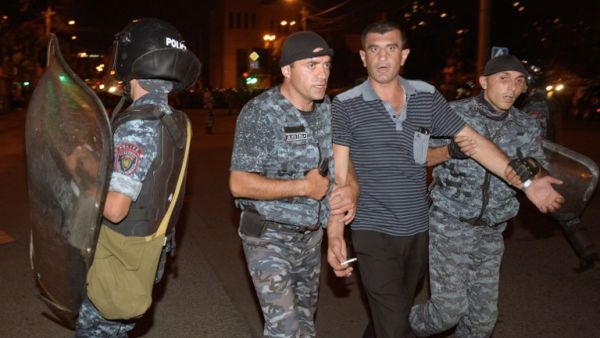 Armenian police detain opposition supporters blocking a street leading to Erebuni police station seized by gunmen - supporters of fringe jailed opposition leader Zhirair Sefilyan - in Yerevan late on July 29, 2016. (AFP/Karen Minasyan) Armenian police detain opposition supporters blocking a street leading to Erebuni police station seized by gunmen - supporters of fringe jailed opposition leader Zhirair Sefilyan - in Yerevan late on July 29, 2016. (AFP/Karen Minasyan)