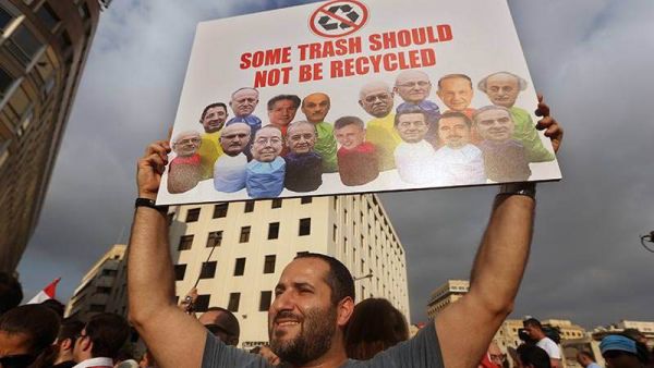 A demonstrator in Beirut participates in Lebanon's "You Stink" protests against government corruption and inefficiency.  Widespread protests grew last month after popular frustration with government inaction on Lebanon's garbage crisis.  (AFP/File)
