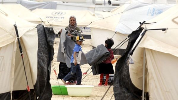According to official figures, the overall number of registered and unregistered Syrian refugees in the Kingdom stands at about 1.3 million (AFP/File)