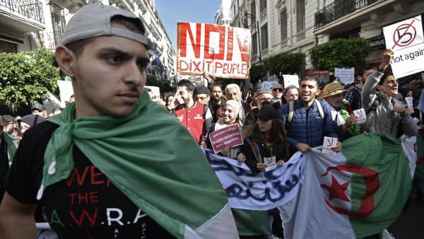Algerians protest against upcoming elections that they view as a sham. / AFP