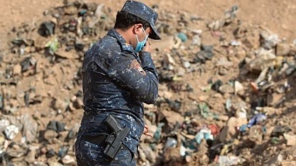فتح مقبرة جماعية لدواعش وأقربائهم في الموصل