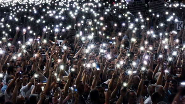 Albania's opposition Democratic Party leader Lulzim Basha addresses to his supporters in front of government headquarters (AFP)