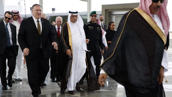 US Secretary of State Mike Pompeo (L) is welcomed by Saudi Foreign Minister Ibrahim Abdulaziz Al-Assaf (C) upon his arrival in the Saudi Red Sea city of Jeddah  (AFP)