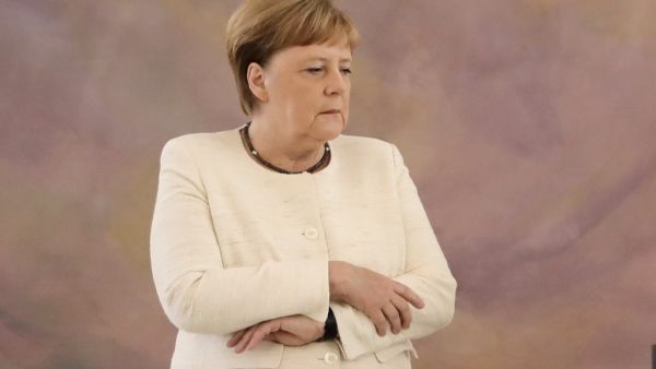 German Chancellor Angela Merkel attends a ceremony where the country's new Justice Minister was given her certificate of appointment by the German President at the presidential Bellevue Palace in Berlin  (AFP)