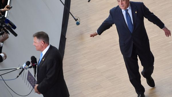 European Parliament President Antonio Tajani arrives as Romania's President Klaus Werner Iohannis (L) speaks to the press prior to an European Council Summit at The Europa Building in Brussels (AFP)
