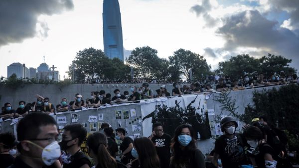 Protesters attempt to storm into the government headquarters in Hong Kong on July 1, 2019 on the 22nd anniversary of the city's handover from Britain to China (AFP)