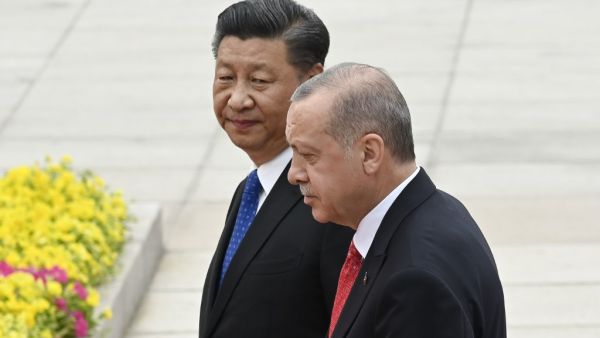 Turkish President Recep Tayyip Erdogan (R) and Chinese President Xi Jinping (L) inspect Chinese honour guards during a welcome ceremony outside the Great Hall of the People in Beijing on July 2, 2019.  WANG ZHAO / AFP