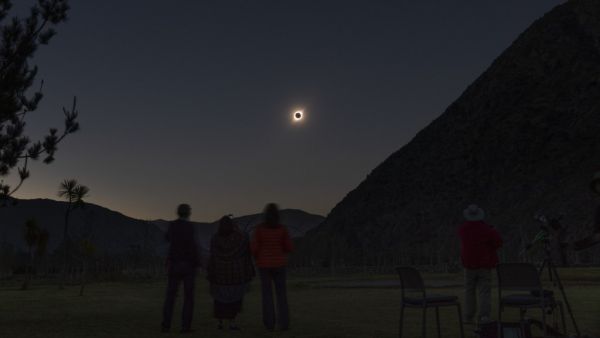 People watch the total solar eclipse from El Molle, Chile, on July 2, 2019. Tens of thousands of tourists braced Tuesday for a rare total solar eclipse that was expected to turn day into night along a large swath of Latin America's southern cone, including much of Chile and Argentina. Stan HONDA / AFP