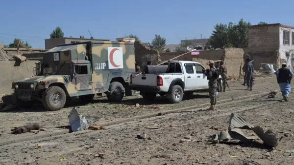 Afghan security personnel arrive at the site of a car bomb attack that targeted an intelligence unit in Ghazni  (AFP)