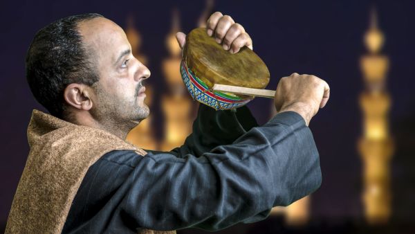 Wake up man calling sleeping people to wake up for sohour in Egypt (Shutterstock)	