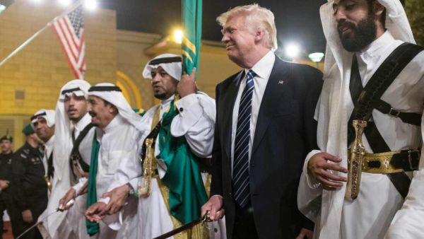 U.S. President Donald Trump brandishes a sword during a welcome ceremony in Riyadh, Saudi Arabia on May 20, 2017 /AFP