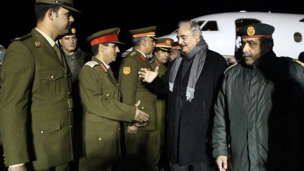 Khalifa Haftar, second from right, the military leader of the so-called Libyan National Army, is greeted after a trip to Russia /AFP