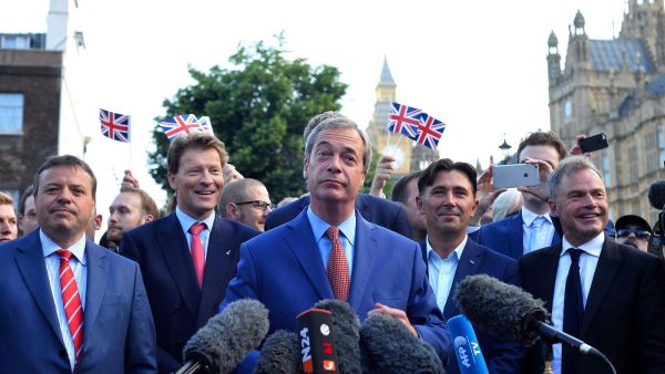 Nigel Farage has been pictured filming refugees entering the UK /AFP