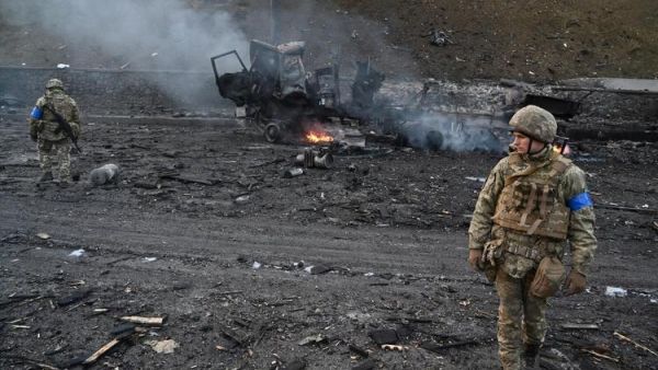 Ukrainian service members look for unexploded shells after a fighting with Russian raiding group in the Ukrainian capital of Kyiv in the morning of February 26, 2022, according to Ukrainian service personnel at the scene. Ukrainian soldiers repulsed a Russian attack in the capital, the military said on February 26 after a defiant President Volodymyr Zelensky vowed his pro-Western country would not be bowed by Moscow. It started the third day since Russian leader Vladimir Putin unleashed a full-scale invasion that has killed dozens of people, forced more than 50,000 to flee Ukraine in just 48 hours and sparked fears of a wider conflict in Europe. (Photo by Sergei SUPINSKY / AFP) Russian Invasion of Ukraine From Feb. 24 to Feb. 27