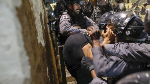 Israeli police detain a Palestinian protester in Jerusalem's Old City