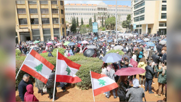 A storm in the making. Public servants during a protest in downtown Beirut against cuts to their salaries, April 17. 