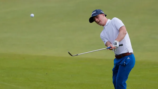 Brendan Lawlor of Ireland chips onto the 18th green during the EDGA Scottish Open