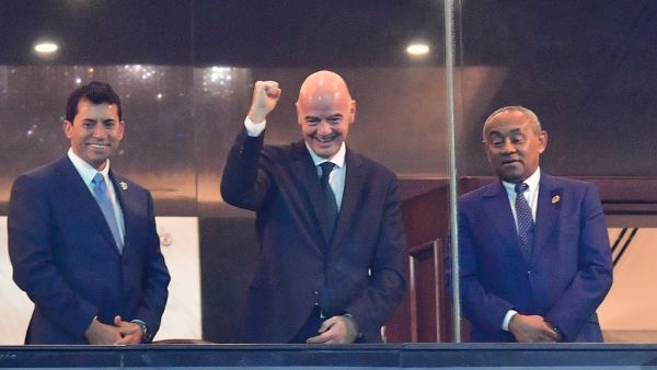 Fifa President Gianni Infantino (C) reacts next to CAF President Ahmad Ahmad (R) and Egyptian Youth and Sports minister Ashraf Sobhy ahead of 2019 AFCON final between Senegal and Algeria at the Cairo International Stadium on July 19, 2019