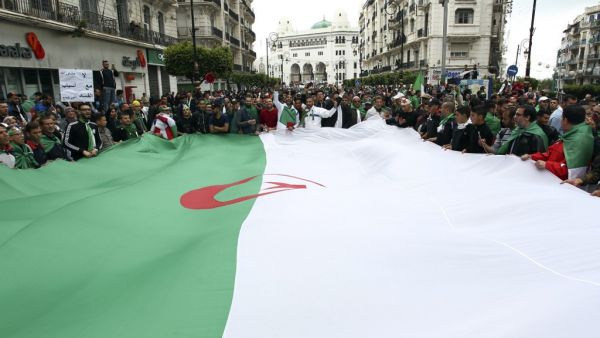 Algerians wave a giant national flag during an anti government demonstration in the capital Algiers, on April 19, 2019. (AFP/ File Photo)