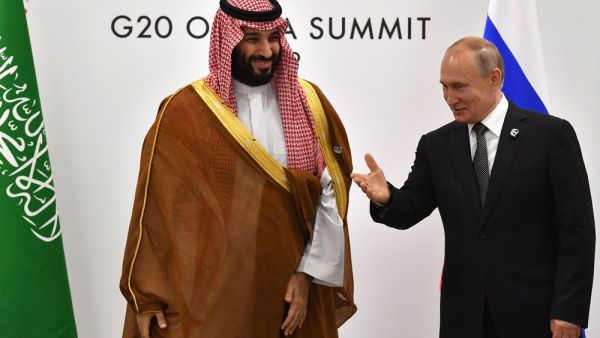 Vladimir Putin and Mohammed bin Salman on the sidelines of the G20 Summit in Osaka on June 29. (Yuri Kadobnov/AFP via Getty Images)