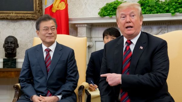 US President Donald Trump and South Korean President Moon Jae-in speak during a meeting in the Oval Office of the White House. (Saul Loeb / AFP)