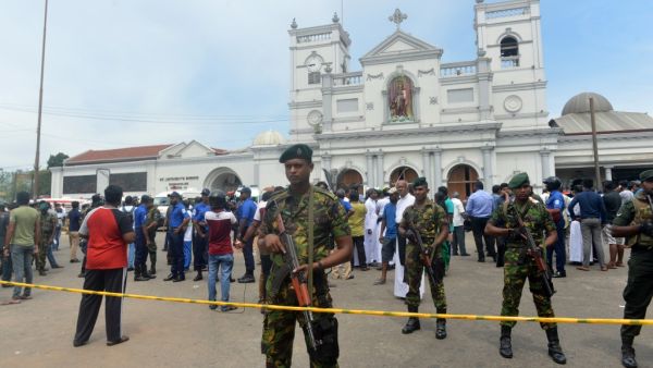 Sri Lankan security personnel keep watch outside the church premises following a blast at the St. Anthony's Shrine in Kochchikade, Colombo on April 21, 2019. (ISHARA S. KODIKARA / AFP)