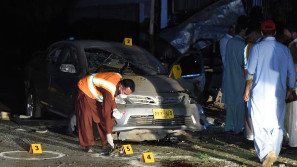 Pakistani security officials examine the site of a bomb blast in Quetta on May 13, 2019. Four police were killed and nine people wounded. (BANARAS KHAN / AFP)