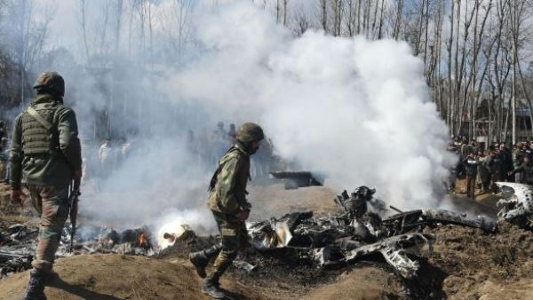 Indian soldiers inspect the remains of an Indian Air Force helicopter after it crashed in Budgam district, outside Srinagar. (Tauseef Mustafa/AFP/Getty)