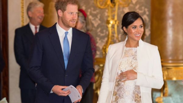 UK's Meghan, Duchess of Sussex (R) and Prince Harry. (AFP)
